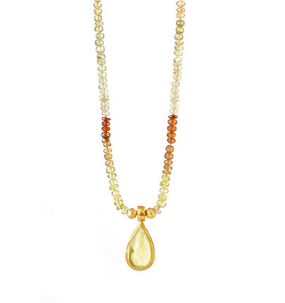 <P dir=ltr class=Body>Add some sophistiction and glamor to your wardrobe. This exclusively hand-crafted 18" Necklace is set to charm with gleaming Green Garnets, and&nbsp;a large shining Lemon Quartz drop wrapped in 24K Gold. It makes the perfect accessory to any ensemble.</P>