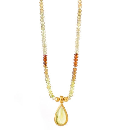 <P dir=ltr class=Body>Add some sophistiction and glamor to your wardrobe. This exclusively hand-crafted 18" Necklace is set to charm with gleaming Green Garnets, and&nbsp;a large shining Lemon Quartz drop wrapped in 24K Gold. It makes the perfect accessory to any ensemble.</P>