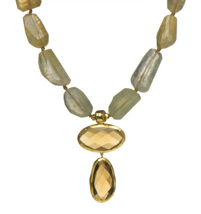 <P dir=ltr class=Body>Necklace of Prehnite nuggets with two large Whisky Quartz drops wrapped with 24k gold 20" Long or upon request Whisky Quartz drops may vary in shape and size</P>