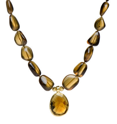 <P dir=ltr class=Body>Smooth Smoky Topaz Nugget Necklace with a Cognac Quartz Center wrapped in 24K Gold. Cognac Quartz center may Vary in Shape and Size 18" Long or upon request</P>