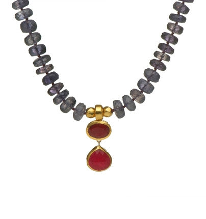 <P dir=ltr class=Body>Iolite Necklace with two drops of Ruby Wrapped with 24K Gold 18" Long. Drops measure 14mm Wide and 28mm Long.</P>