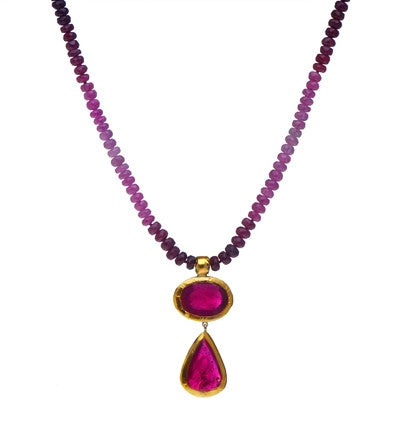 <P dir=ltr class=Body>Multi color Ruby Necklace with two Ruby(treated) Drops wrapped with 24K Gold 18" Long or upon request. Both drops are approx 37mm Long Size, Shape and Color of Ruby Drops may vary.</P>