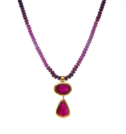 <P dir=ltr class=Body>Multi color Ruby Necklace with two Ruby(treated) Drops wrapped with 24K Gold 18" Long or upon request. Both drops are approx 37mm Long Size, Shape and Color of Ruby Drops may vary.</P>