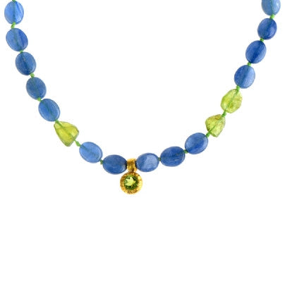 <P dir=ltr class=Body>Kyanite and Peridot Necklace with a small Peridot Drop wrapped with 24K Gold 18" Long or upon Request</P>