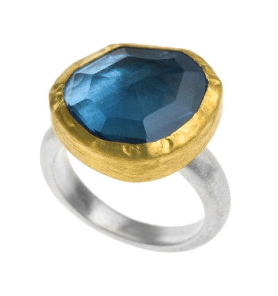 <P dir=ltr class=Body>Uneven shaped Blue Topaz Ring wrapped with 24K Gold on a Sterling Silver Band</P>