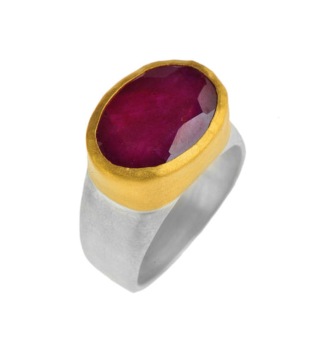 <SPAN style="COLOR: #644f21">Oval Ruby(corundum) ring wrapped with 24k Gold on a Silver Sterling Band <P dir=ltr class=Body>Measurments of stone is 16 x 12mm Available any size</P>