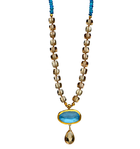 <P dir=ltr class=Body>Necklace of Apatite and Cognac Quartz with two drops of Blue Topaz and Cognac Quartz, wrapped with 24K 18" Long or upon request Measurments of Drop approx 35mm long X 25mm wide</P>