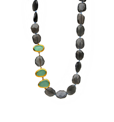 <P dir=ltr class=Body>Necklace of Gray Moonstone with three Peruvian Chalcedony stones wrapped with 24K Gold 18" Long or upon request</P>