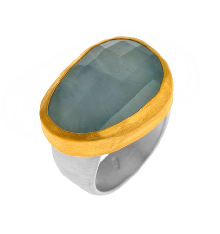 <P dir=ltr class=Body>Uneven shaped&nbsp; Large Aquamarine Ring wrapped with 24K Gold with a Sterling Silver Band Available any size! Shape and size of Aquamarine may vary</P>