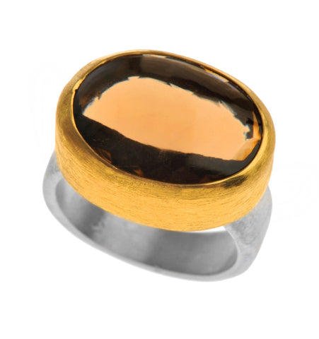 <P dir=ltr class=Body>Oval cabochon Smoky Topaz Ring wrapped with 24K Gold with a Silver Sterling band Available any size! </P>