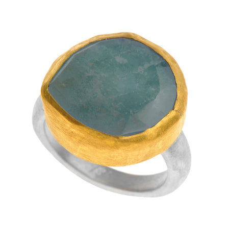 <P dir=ltr class=Body>Uneven Shaped Aquamarine Ring wrapped with 24K Gold on a Sterling Silver Band Available any size! Shape and size of Stone may vary</P>