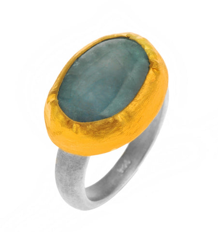 <P dir=ltr class=Body>Oval Aquamarine Ring wrapped with 24K Gold with a Sterling Silver Band Available any size! Shape and size of Stone may vary</P>