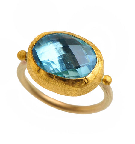 <P dir=ltr class=Body>Gold oval Blue Topaz ring wrapped with 24k gold </P> <P dir=ltr class=Body>Measurments of stone is&nbsp;16 x 14mm Available any size! </P>