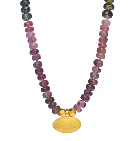 <P dir=ltr class=Body>Long Necklace of Pink and Green Tourmalines with an oval pure 24k Gold Disc (14x8mm) 20" Long or upon request</P>