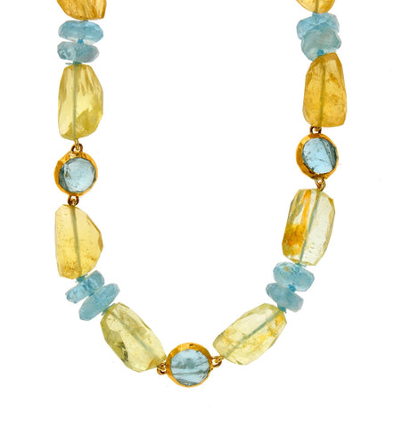 <P class=Body dir=ltr>Yellow Aquamarine Nugget Necklace with three round Aquamarines wrapped with 24K Gold</P>