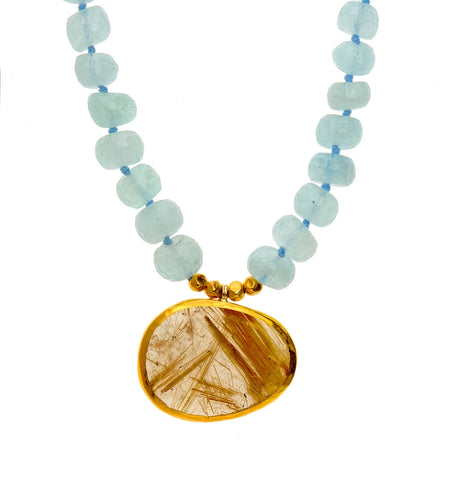 <P dir=ltr class=Body>Aquamarine Necklace with an uneven shaped oval Rutil Quartz wrapped with 24K Gold</P>