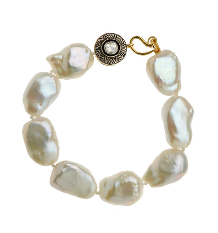 <P dir=ltr class=Body>Large Fresh Water Pearls Bracelet with a lovely Large Sterling Silver and Diamonds center on 18K Gold. Very Classic and Unique for any occasion. One Of A Kind! </P>