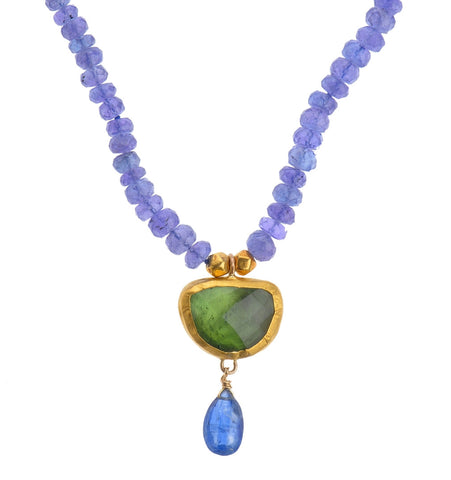 <P class=Body dir=ltr>Tanzanite Necklace with an uneven Green Tourmaline Drop wrapped with 24K Gold 17" Long or upon request. Length of both drops is 30mm long. Shape and Color of Tourmaline may vary</P>