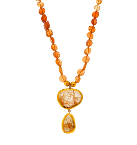 <P dir=ltr class=Body>Hessonite Necklace with two drops of Ruthilated Drops, both wrapped with 24K Gold</P>