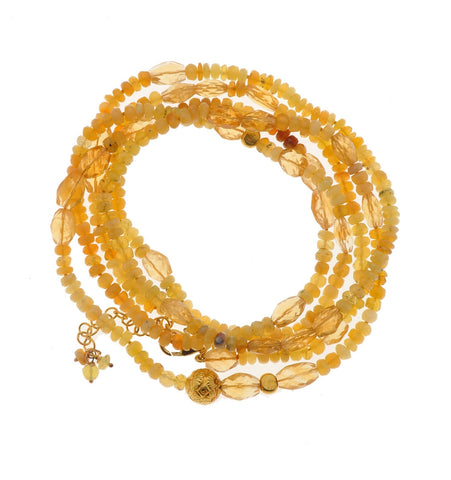 <P dir=ltr class=Body>Long Bracelet of Yellow Opal and Citrine with two Nuggets of 18K Gold 42" Long or upon request</P>