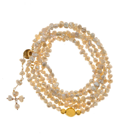 <P dir=ltr class=Body>Long Bracelet of White Kashi Pearls with Four 18K Gold Nuggets 40" Long or upon request</P>