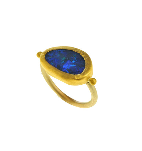 <P dir=ltr class=Body>Small uneven Shaped Opal Gold Ring wrapped with 24K Gold Measurments of stone is&nbsp;17 x 11mm Shape, Size and Color of Opal may vary</P>