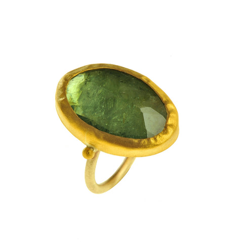 <P dir=ltr class=Body>Large uneven Oval shaped Green Tourmaline Gold Ring wrapped with 24K Gold Measurments of stone is&nbsp;17 x 25mm Shape, Size and Color of Tourmaline may vary</P>