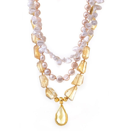 This amazingly beautiful three-stranded Necklace is finely hand-crafted of dazzling Citrine nuggets and luminescent Pearls. It has a gorgeous pear-shaped Citrine drop wrapped in 24K Gold. It is feminine and elegant, and will be a treasure for a lifetime. Length 16.5"&nbsp;to 23"