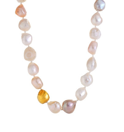 Add something regal and feminine to your jewelry collection. This gorgeous Necklace is hand-crafted of wonderful Freshwater Pearls with one stone lovingly wrapped in 24K Gold. The Pearls are lustrous and shiny, each one unique, making this Necklace elegantly beautiful and the perfect accessory to any ensemble. 19" Long