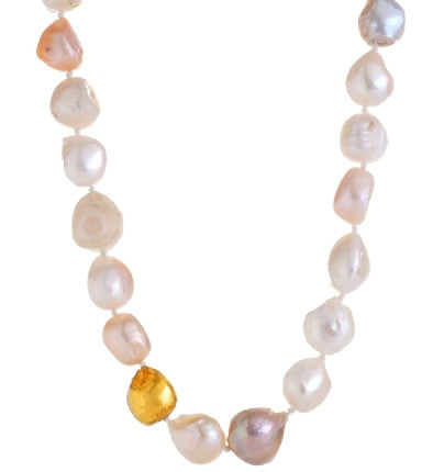 Add something regal and feminine to your jewelry collection. This gorgeous Necklace is hand-crafted of wonderful Freshwater Pearls with one stone lovingly wrapped in 24K Gold. The Pearls are lustrous and shiny, each one unique, making this Necklace elegantly beautiful and the perfect accessory to any ensemble. 19" Long